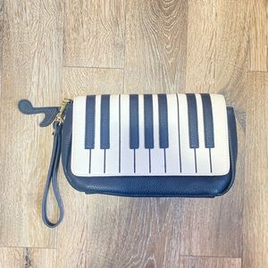 Piano clutch purse with music note clip. Never used!